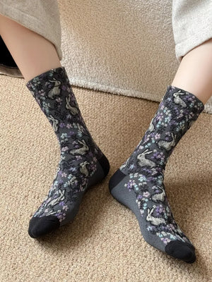light gray socks featuring elastic cuff and floral and animal-print