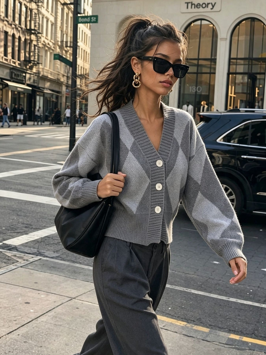 Green cardigan featuring buttoned and argyle