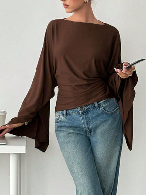 95% polyester, 5% elastane Care instructions: Machine wash cold top in Brown with relaxed silhouette