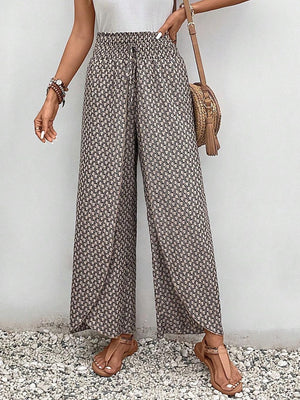 Palazzo pants with a geometric print and drawstring waist.