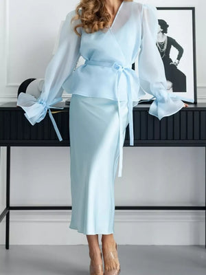 two-piece set in Brown with belted and midi
