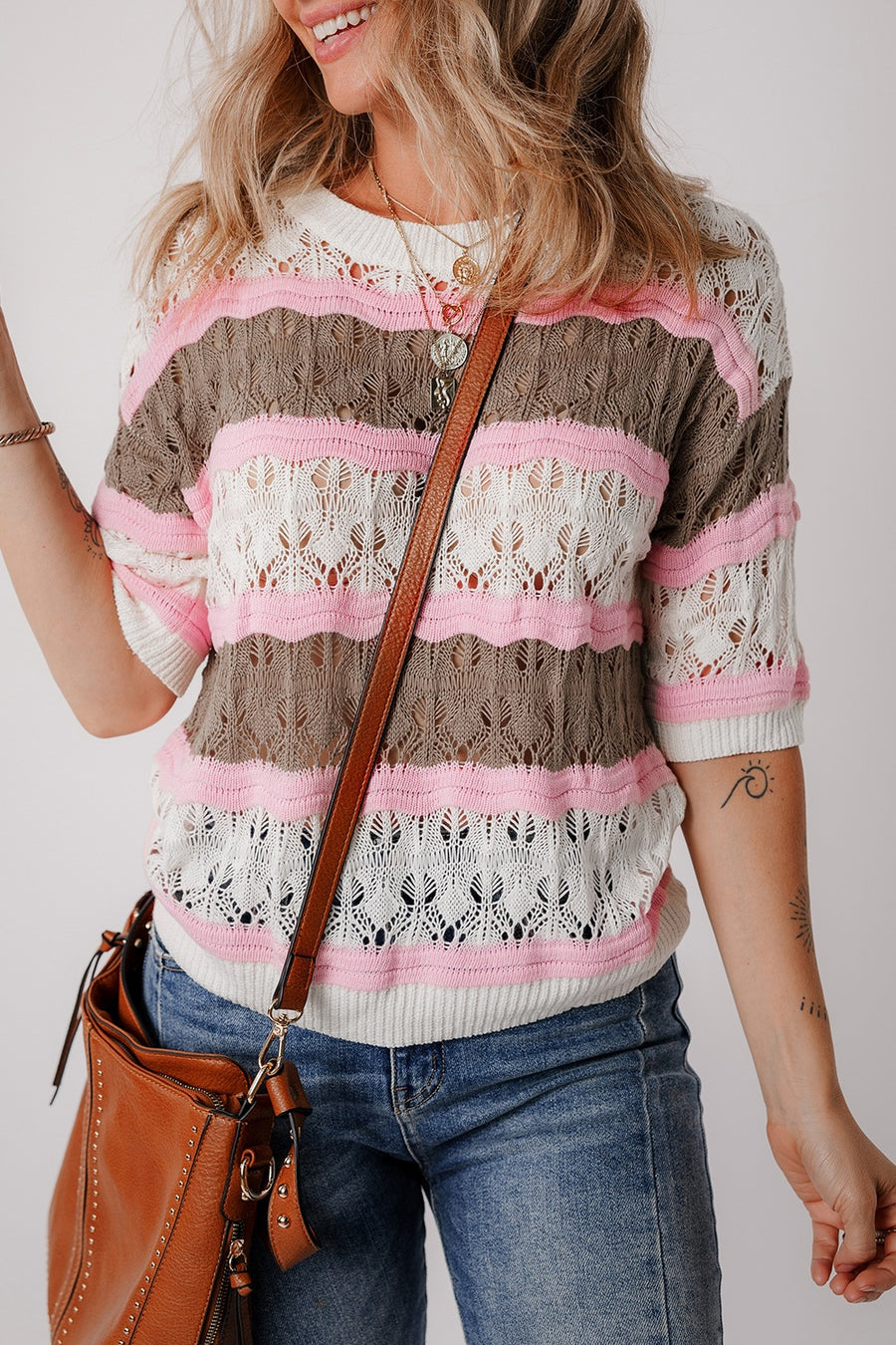 Striped openwork knit top with pink, taupe, and white stripes.