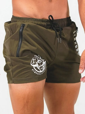 Army green athletic shorts with drawstring, zipper pockets, and graphic logo detail.
