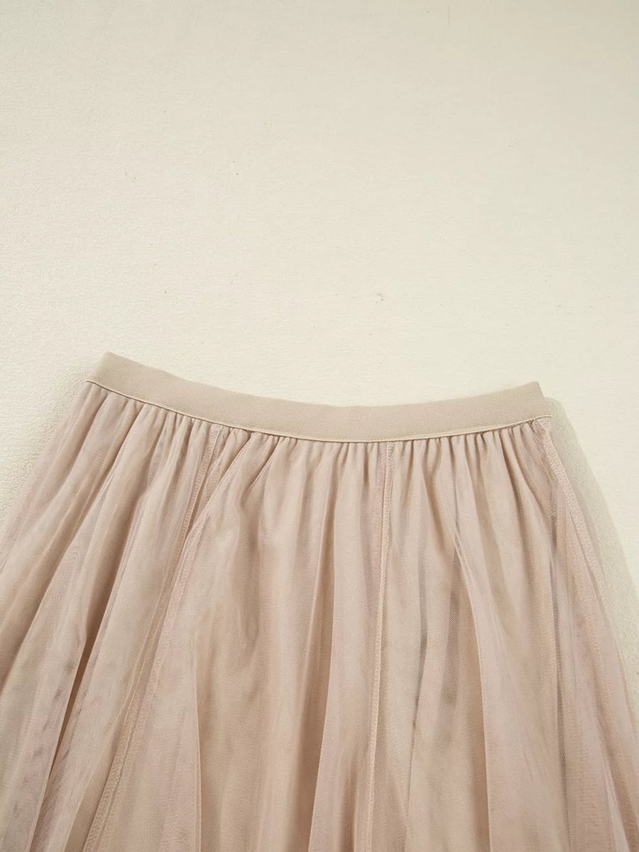 Lace overlay flared midi skirt in beige with elastic waistband and tulle fabric.