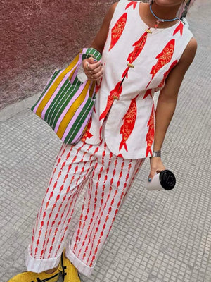 Red fish print sleeveless top and pants set with gold button details.