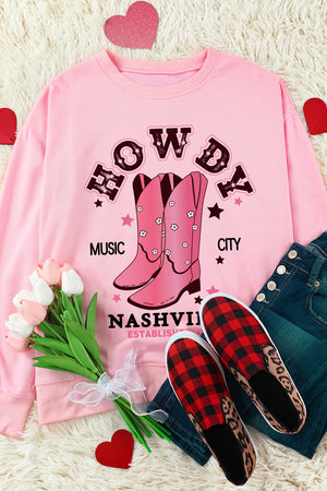 Blush pink crewneck sweatshirt with Nashville graphic, cowboy boots, and floral details.