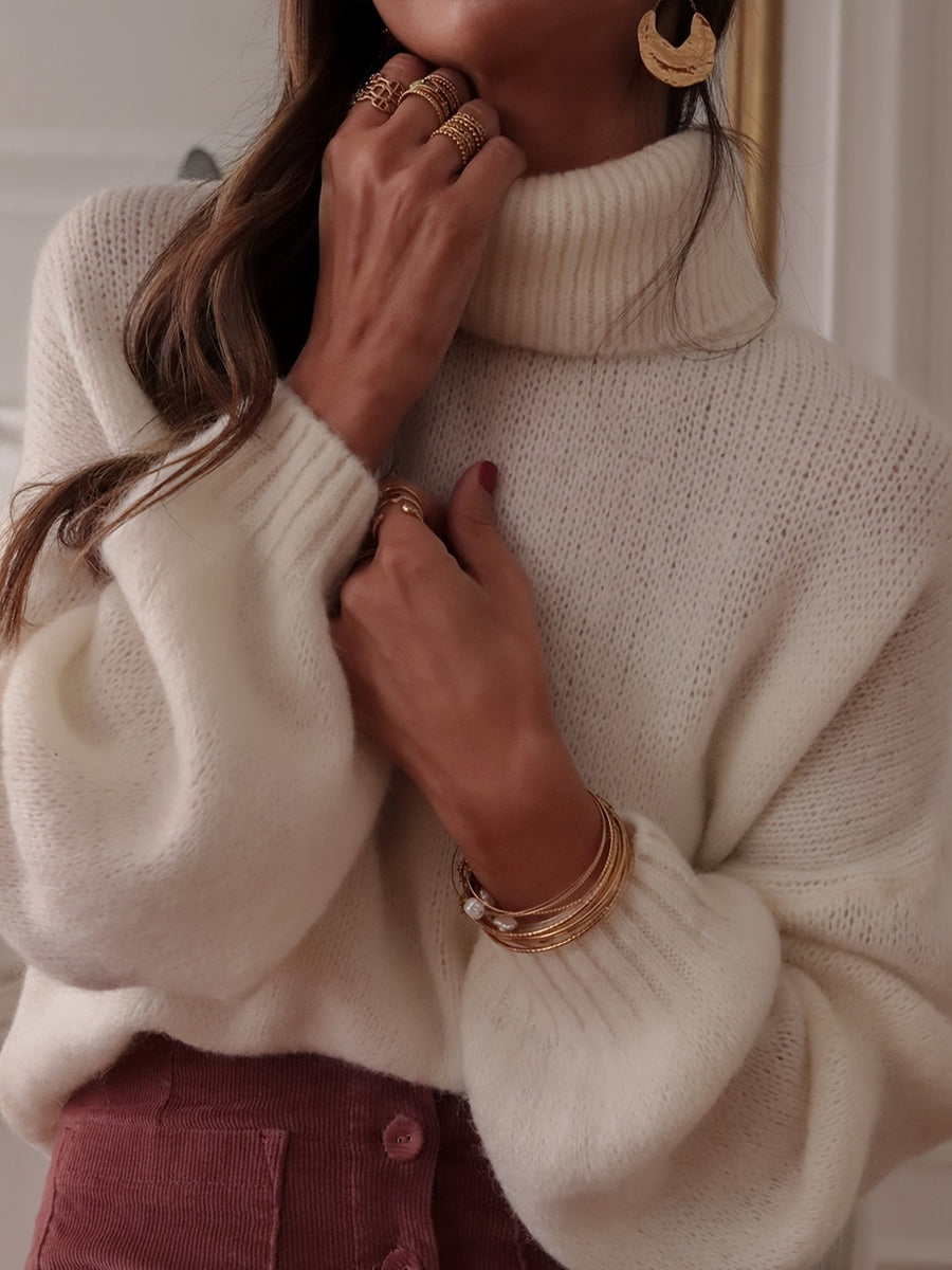 100% polyester Care instructions: Machine wash cold turtleneck sweater in ivory with oversized silhouette