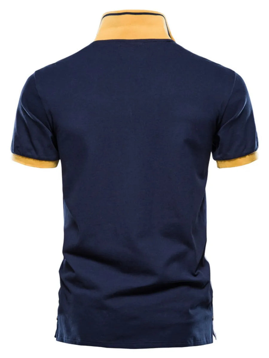 Navy polo shirt with yellow collar and sleeve trim, short sleeves, casual style.