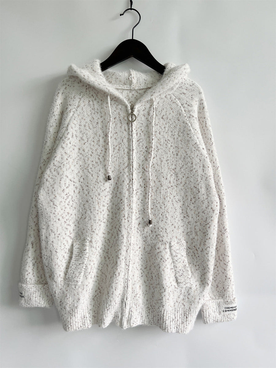 White speckled knit relaxed zip-up hoodie with ring zipper and drawstring hood.