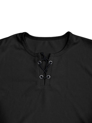 Black cotton t-shirt with lace-up V-neck detail and grommets.