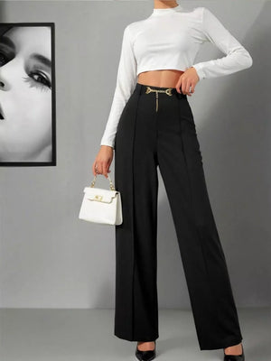 Black wide-leg high-waist maternity trousers with gold chain detail at the waist.