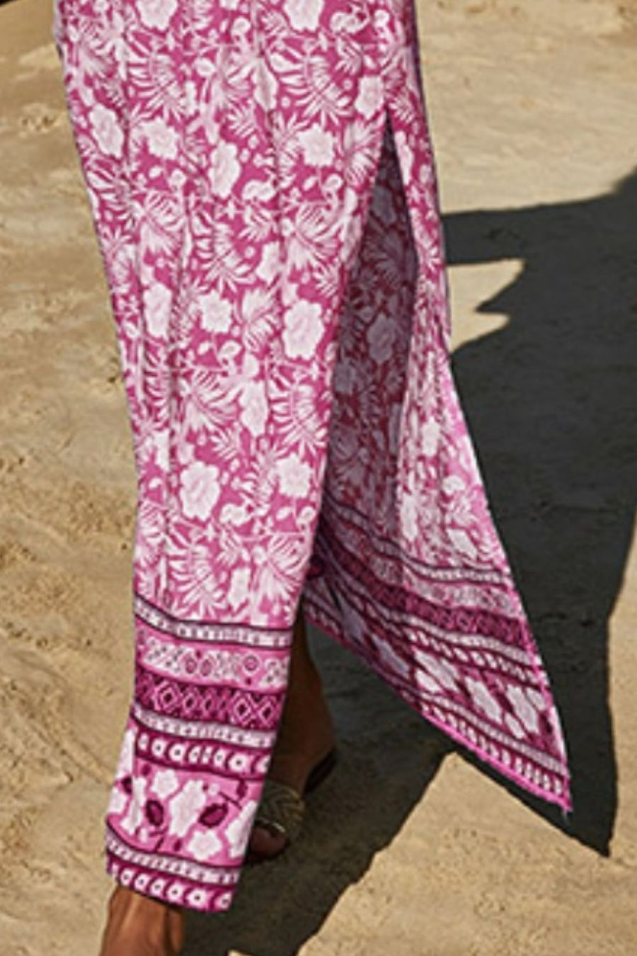 Pink floral print maxi skirt with side slit and patterned hem