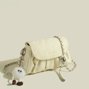 Mini ruched pu leather shoulder bag in pastel yellow with chain strap and fuzzy charm