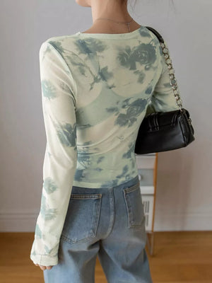 Sheer floral print long sleeve t-shirt with crew neck in light green and blue tie-dye.