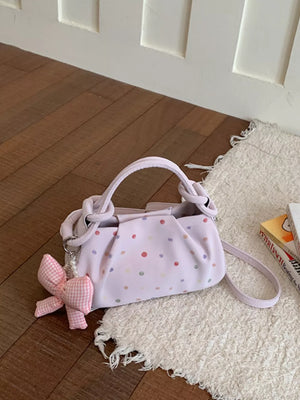 crossbody bag in Pink with polka dot and bow charm