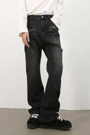 Carpenter jeans in washed black denim with relaxed fit and utility pockets.