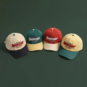 Embroidered baseball cap with "UNDERSTAND?" text in red and yellow, available in multiple colors.