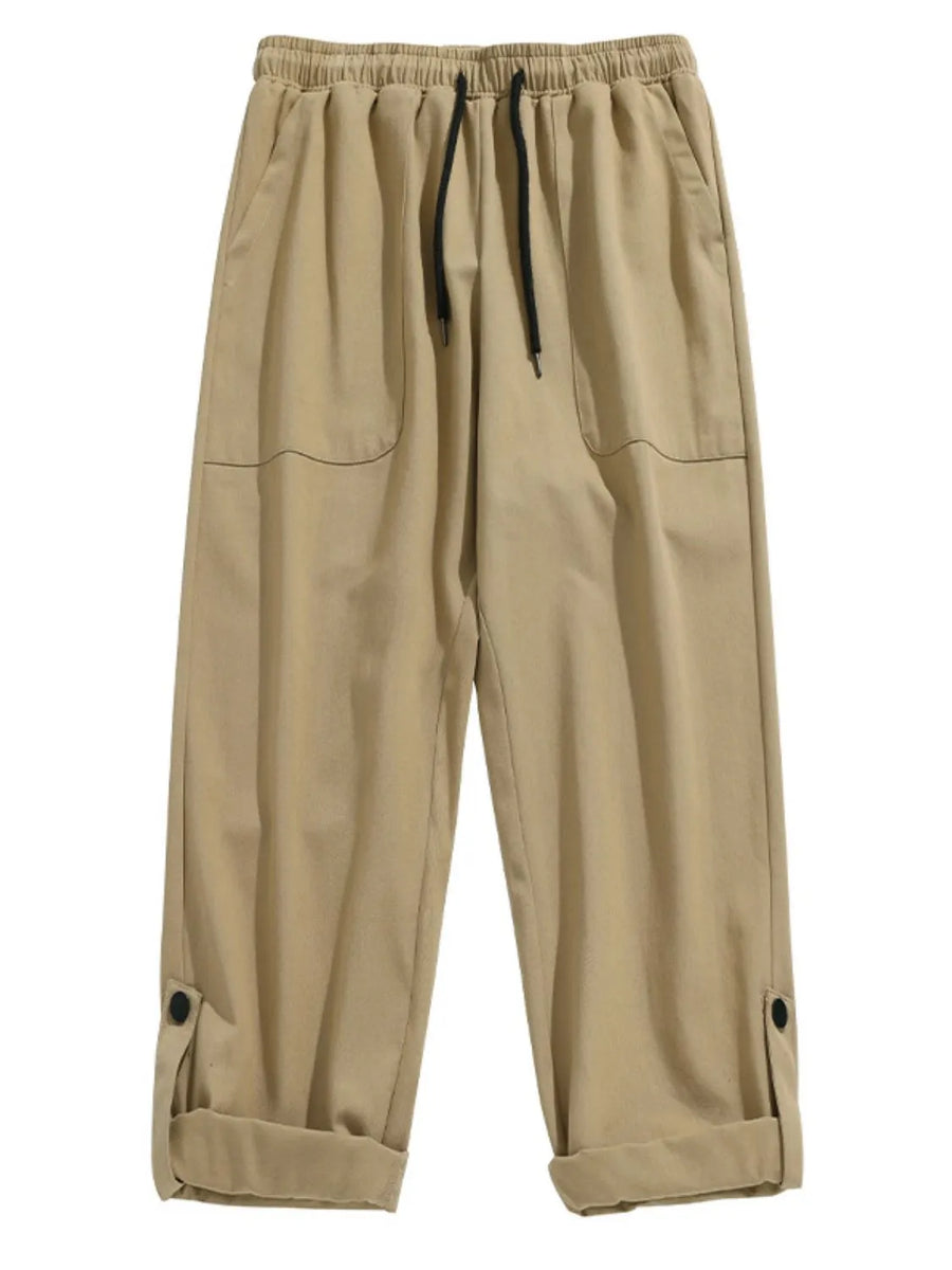Khaki relaxed fit cuffed cargo trousers with drawstring waist and button tab cuffs.