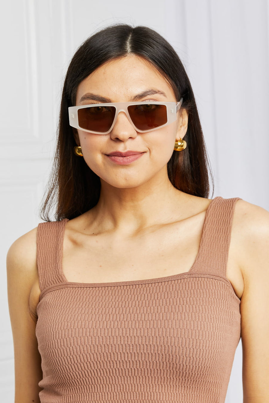 Angular acetate rectangle sunglasses in caramel with brown lenses.