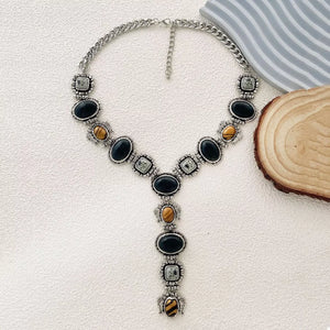 black necklace featuring adjustable length and striped