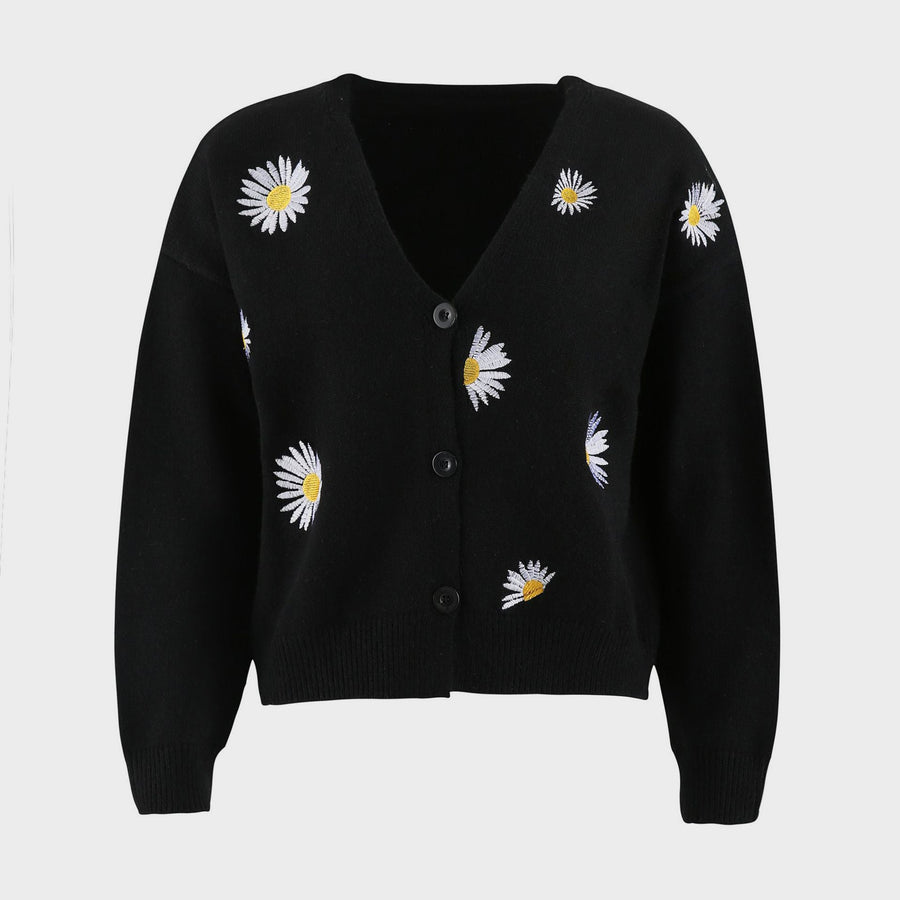 Black V-neck cardigan with allover daisy embroidery and button front.