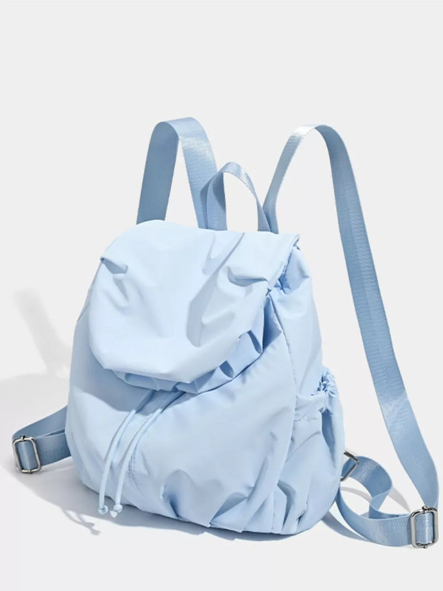 Blue nylon drawstring backpack with flap closure and adjustable straps.