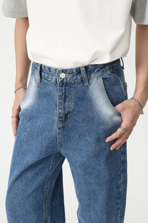 Faded panel wide-leg jeans in medium wash denim with a relaxed fit.