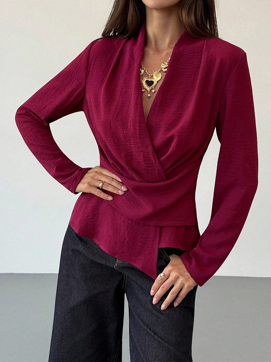 100% polyester Care instructions: Machine wash cold wrap top in burgundy with fitted silhouette