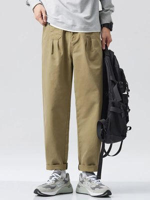 Men's relaxed fit olive sweatpants with pockets and cuffed hems.