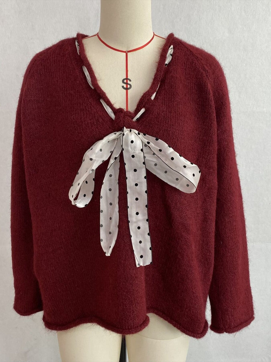 v-neck sweater in Apricot Color with polka dot and tied detail