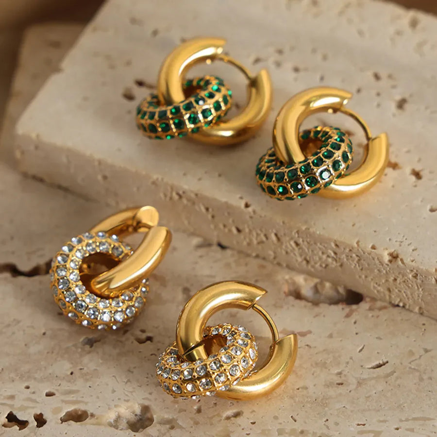 Gold pavé circle interlock hoop earrings with green or clear stones