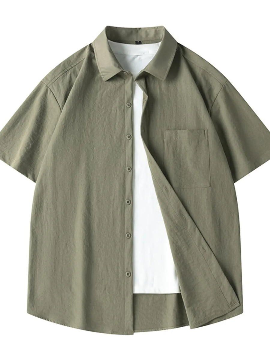 Men's relaxed fit short sleeve shirt in Military Green, cotton, with chest pocket and button-up front.