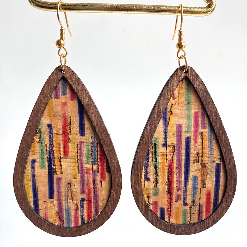 Teardrop earrings with colorful vertical stripes on cork and wood frames