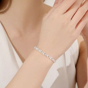 Silver bracelet featuring interlocking links and geometric