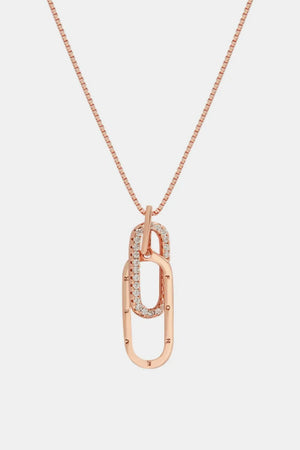Rose gold linked pendant necklace with cubic zirconia and engraved letters.