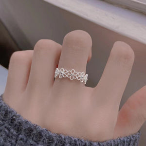 Silver ring with open-front and floral