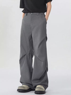 Dark gray oversized wide-leg cargo sweatpants with unique paneling detail.