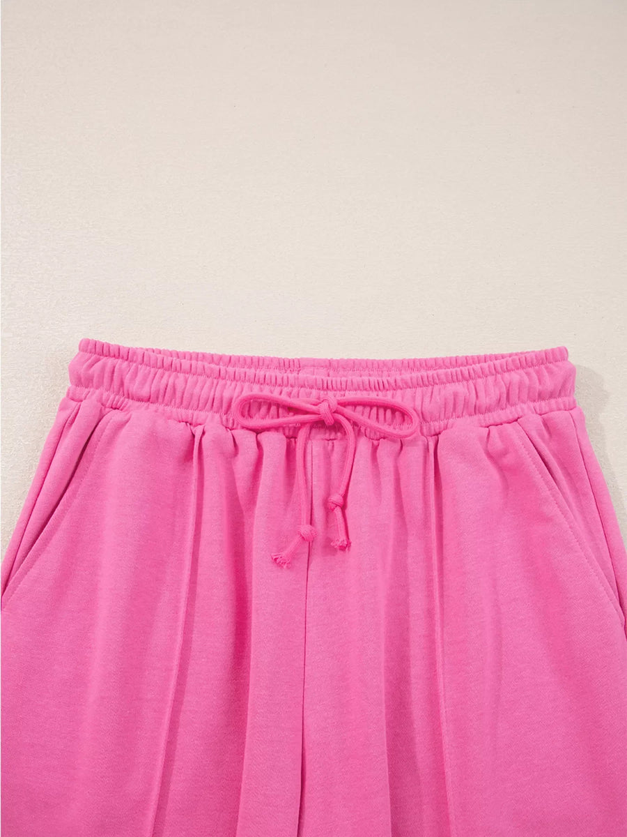 Hot pink casual pants with elastic waistband and drawstring detail