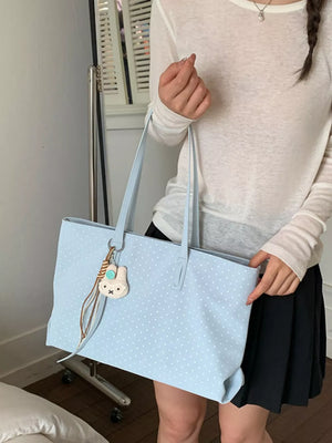 handbag in white with polka dot and shoulder straps