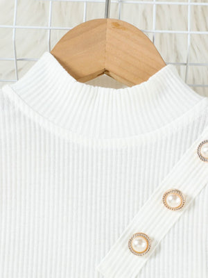 White ribbed mock neck top with pearl and gold button detail