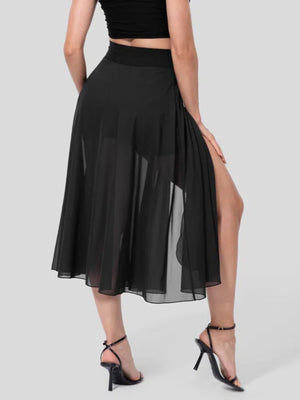Black flowy midi skirt with shorts liner and high slit, featuring a drawstring waist.
