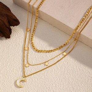 Gold necklace featuring layered and celestial