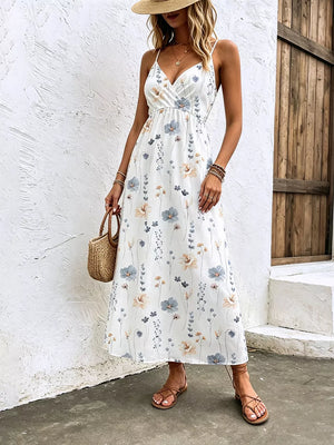 White floral print spaghetti strap midi dress with adjustable straps and a-line cut.
