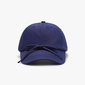 Navy baseball cap with a tied back bow detail