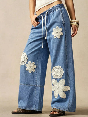 wide-leg jeans featuring floral in cream with 95%cotton, 5%spandex Care instructions: Machine wash cold texture