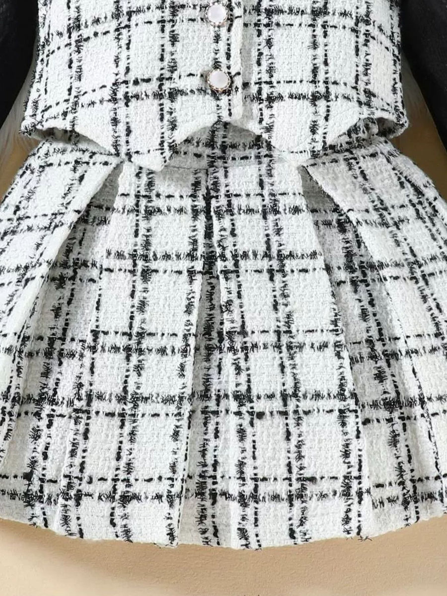 Toddler black and white plaid tweed vest and pleated skirt set with decorative buttons.