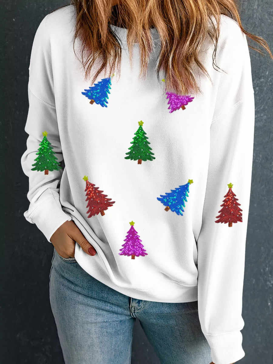 White sweatshirt with colorful sequin Christmas trees and yellow stars.