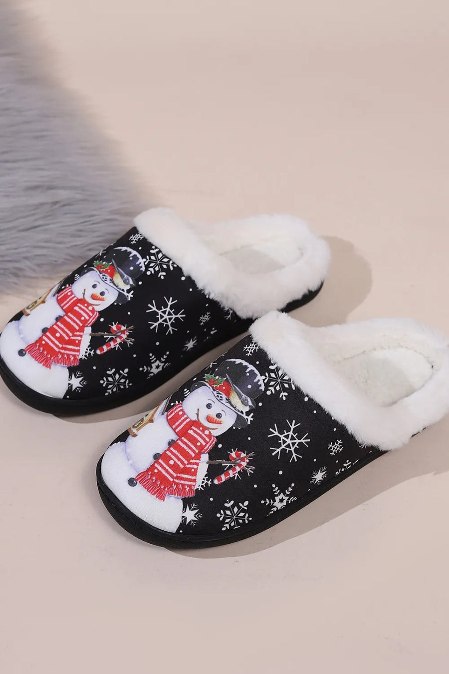 Black faux fur lined slippers with snowman and snowflake print