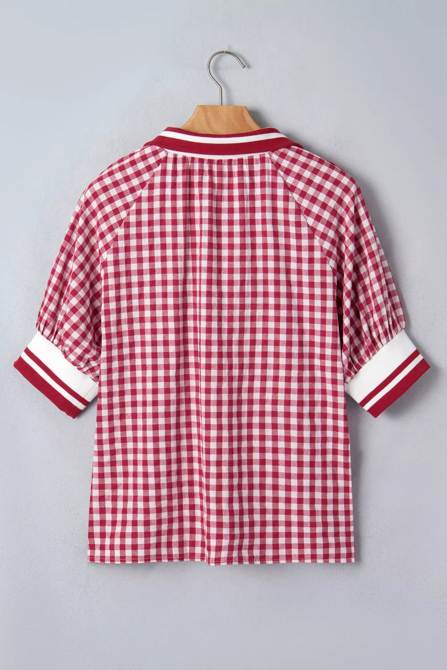 Red gingham cotton blend shirt with puff sleeves and striped collar and cuffs.