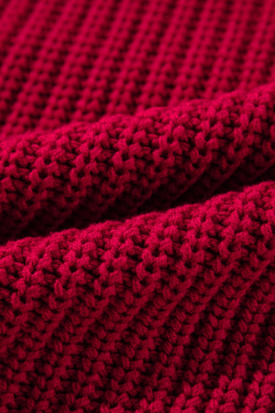 Deep red acrylic knit sweater with ribbed texture detail